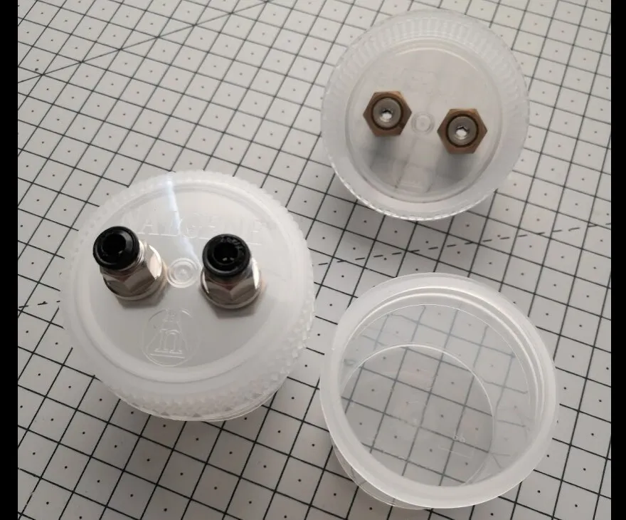 Odour jars: a cap fitted with two push-in fittings, a cap with locknuts seen from inside, and an empty jar