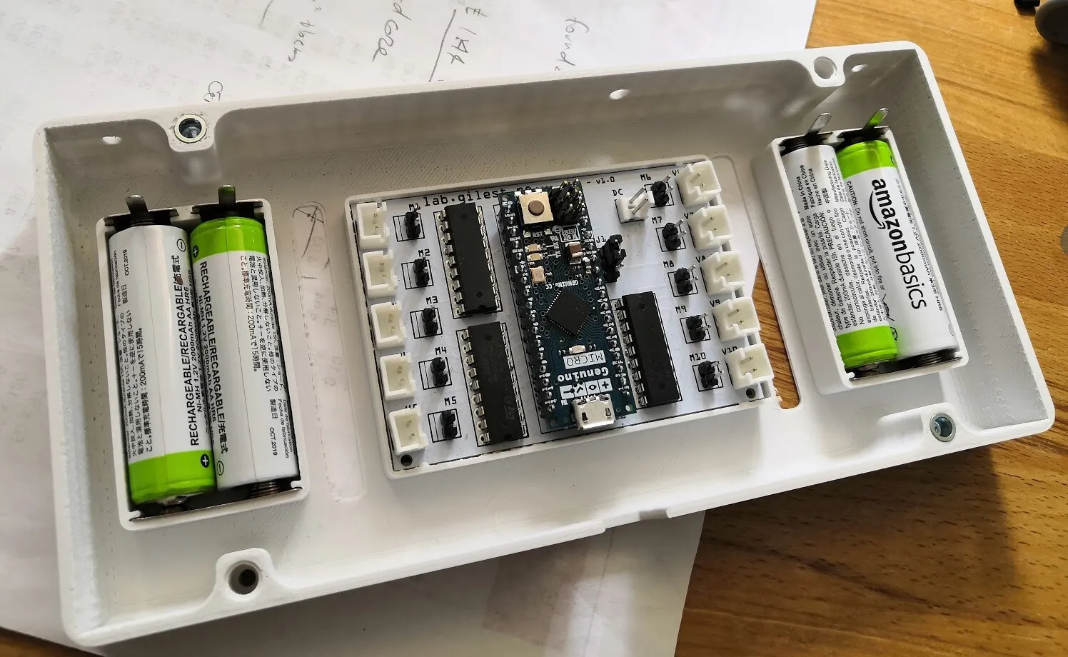 The base with four AA cells in their compartments and the board clicked into place